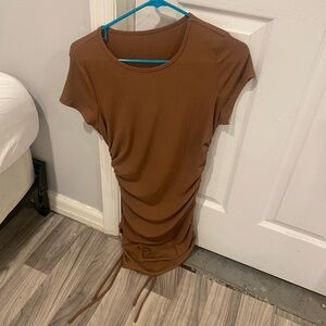 Size medium Brown T-shirt dress length is adjustable with straps on side.